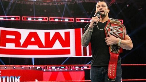 The chairman of the board stands with Roman