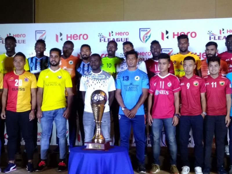 Shahnawaz (2nd from left in bottom row) poses with the I-League 2018-19 trophy and other players