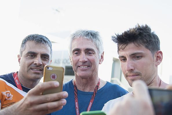 Mick Doohan obliging selfies with fans