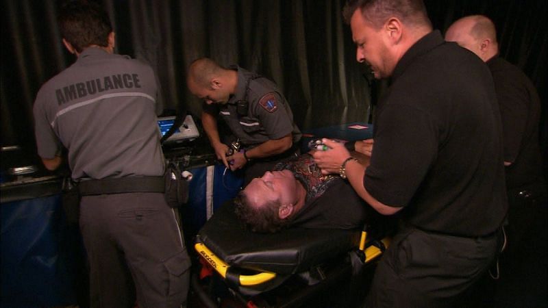 Jerry Lawler getting tended by medical personnel after suffering a heart attack.