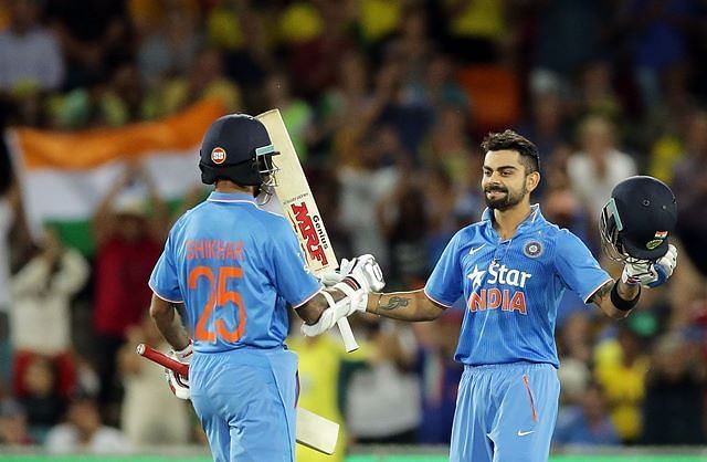 Kohli being congratulated by Dhawan after scoring a century