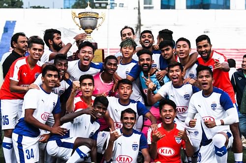 Bengaluru FC 'B' players after their Puttaiah Memorial Cup win at the Bangalore Football Stadium on Sunday