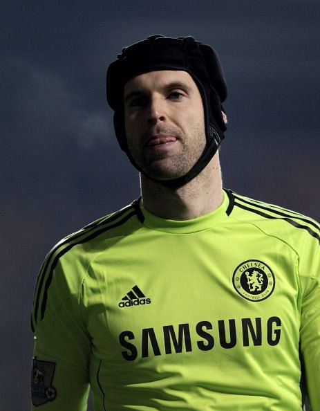 Cech plays with a headgear after a serious head injury in 2006