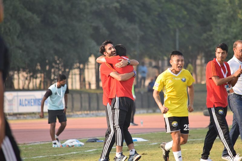 Real Kashmir&#039;s staff celebrate after the team took the lead against Minerva Punjab