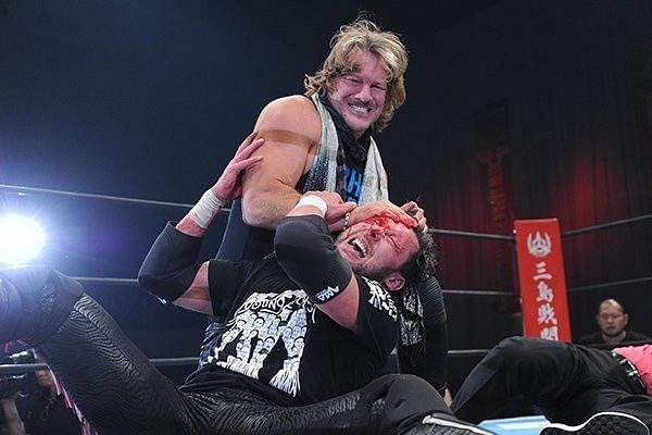Chris Jericho attacking Kenny Omega before