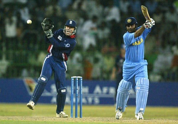 Virendra Sehwag of India on his way to a century watched by Alec Stewart of England