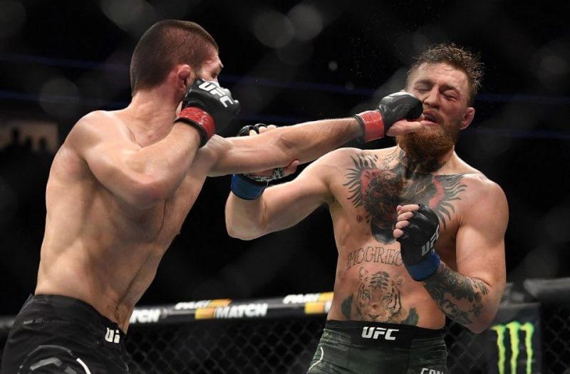 Khabib Nurmagomedov (left) landing a straight left on Conor McGregor (right)