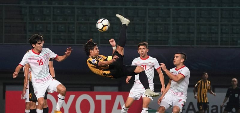 Malaysia earned a credible draw against Tajikistan to keep their qualification hopes alive (Image Courtesy: AFC)