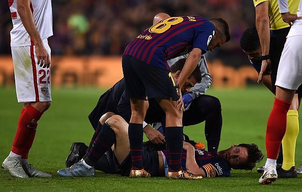 Messi after he fell on the ground with an injury