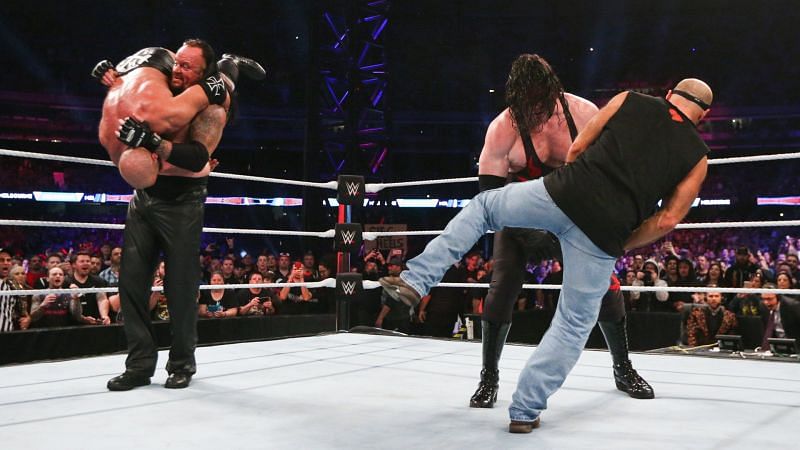 Kane and The Undertaker laid out Triple H and Shawn Michaels to close the show