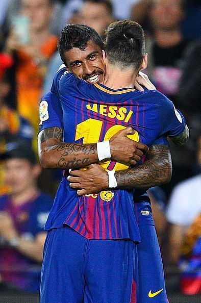 Former Barcelona midfielder Paulinho celebrating a goal with Messi
