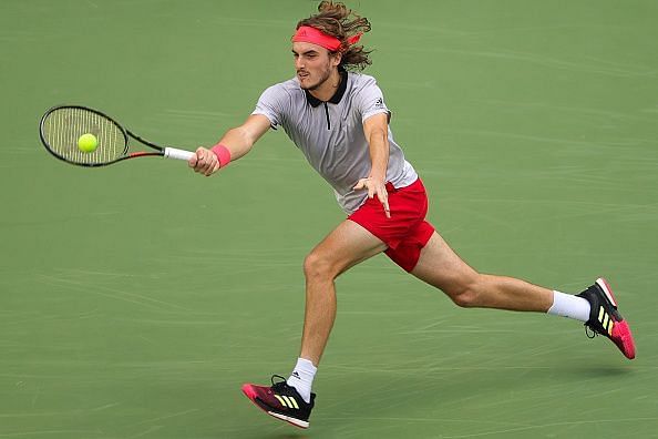 Tsitsipas reaches for the ball in his 1st set against Monfils, Shanghai Masters