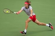 Tsitsipas reaches for the ball in his 1st set against Monfils, Shanghai Masters