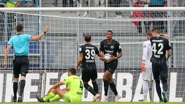 Sebastian Haller holding the ball after scoring a goal