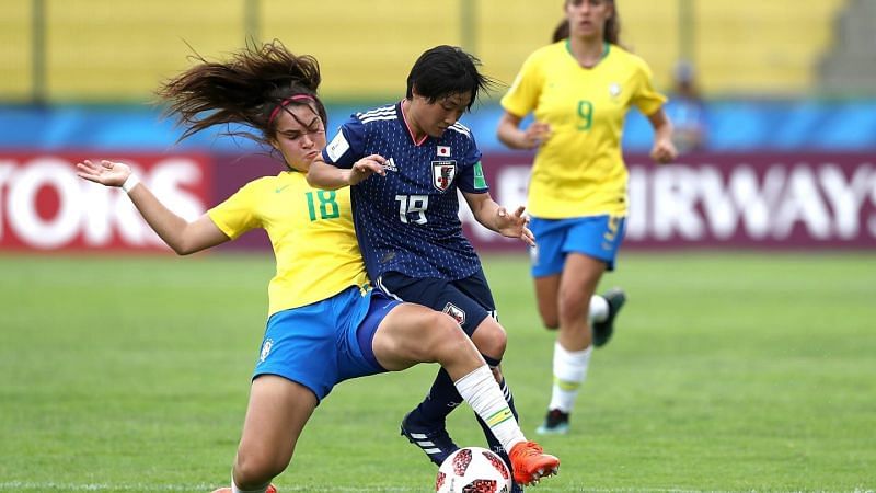 Misaki Morita of Japan on the right in action against Julia of Brazil (Image Courtesy: FIFA)