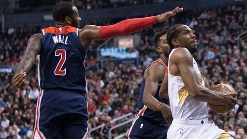 Kawhi going up for a layup, beyond John Wall's best efforts during the Raptors' comfortable win