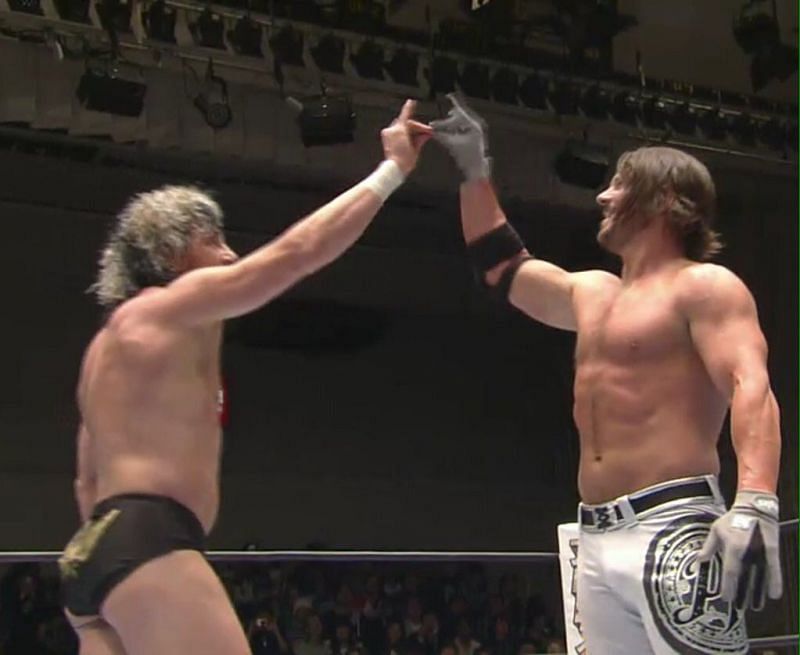 Kenny Omega and AJ Styles sharing a Too Sweet!
