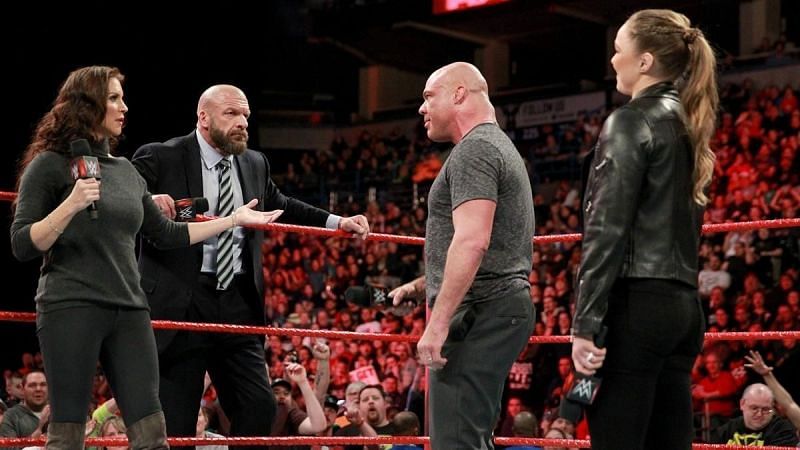 Stephanie McMahon with husband Triple H, Kurt Angle, and Ronda Rousey