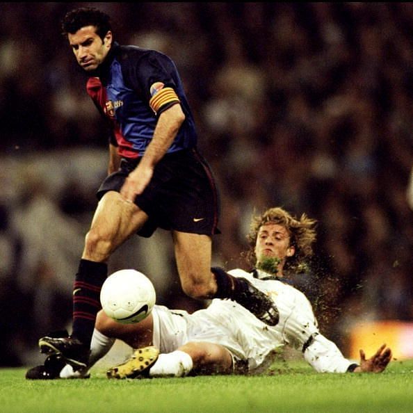 Luis Figo of Barcelona leaves Guti of Real Madrid in his wake