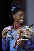 Biles sets record by picking up 13th world championship gold