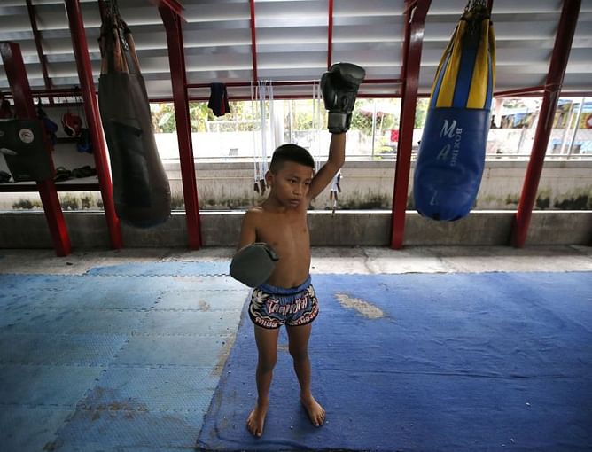 AP PHOTOS: The controversial world of Thai child kickboxing