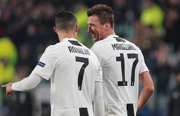 Ronaldo and Mandzukic celebrate the latter&#039;s important opener during their 1-0 win over Valencia