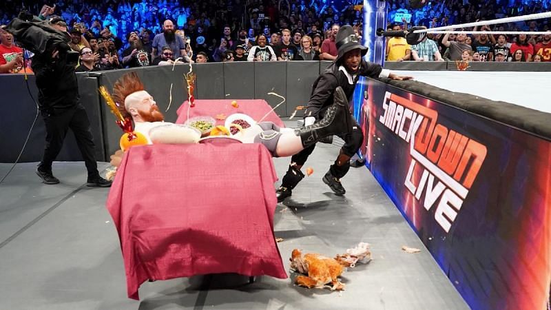 Sheamus is launched into the buffet table.