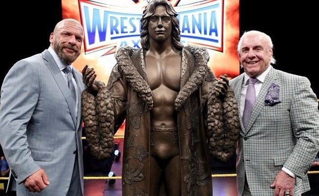 The Game awarded a bronze statue of Flair to the Nature Boy.