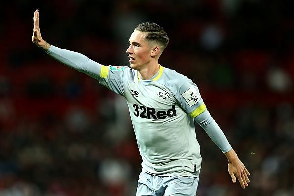 Harry Wilson teases the Red Devils fans with the iconic five times signal.