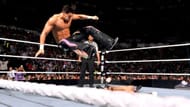 Fandango performs a guillotine leg drop from the top rope.