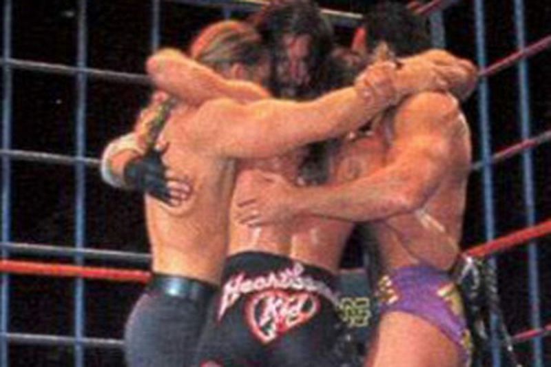 Hunter, HBK, Nash, and Hall hug it out