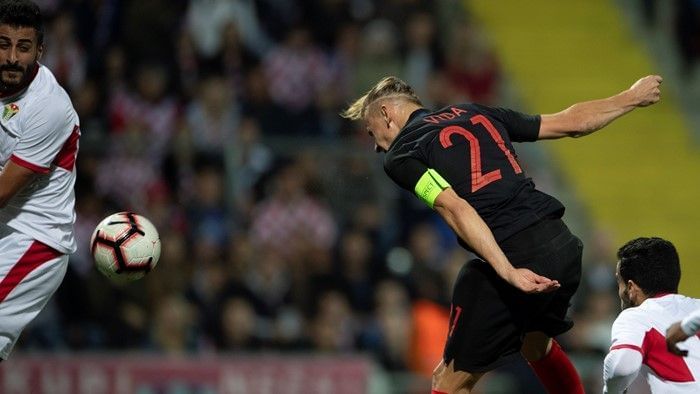 Domagoj Vida nods Croatia ahead against Jordan.