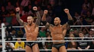 Orton and Batista stand side-by-side as part of Evolution