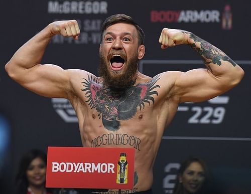 Conor McGregor flexes at the UFC 229: Khabib v McGregor Weigh-Ins