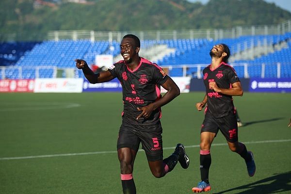 Lancine Toure of Minerva Punjab wheels away after scoring against Aizawl FC during their I-League match