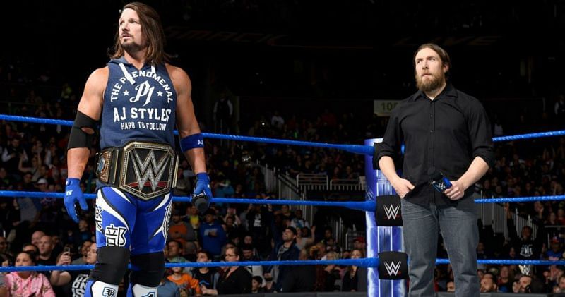 AJ Styles as WWE Champion, while Bryan looks on