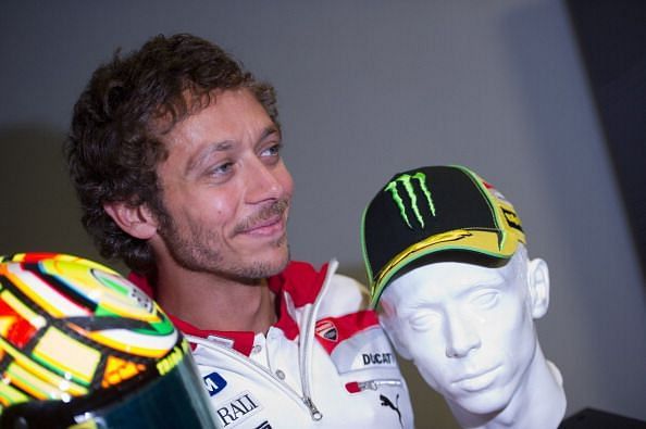 Rossi with his trademark helmet and cap