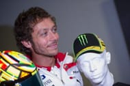 Rossi with his trademark helmet and cap