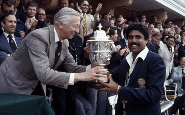 Kapil Dev is handed over the 1983 World Cup trophy.
