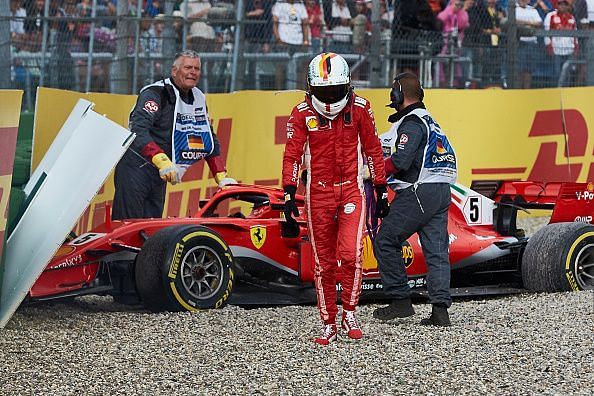 Sebastian Vettel walking away after crashing his car in Germany