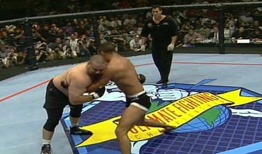 Victor Belfort grapples with Tank Abbott