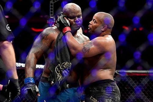 Daniel Cormier consoles Derrick Lewis following Lewis's defeat