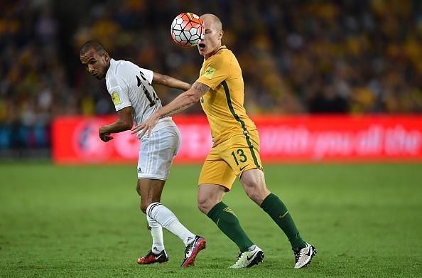 Aaron Mooy from Australia (R) fights for the ball with Yaseen Bakhit of Jordan (L) during the World Cup Asian qualifier football match between Australia and Jordan