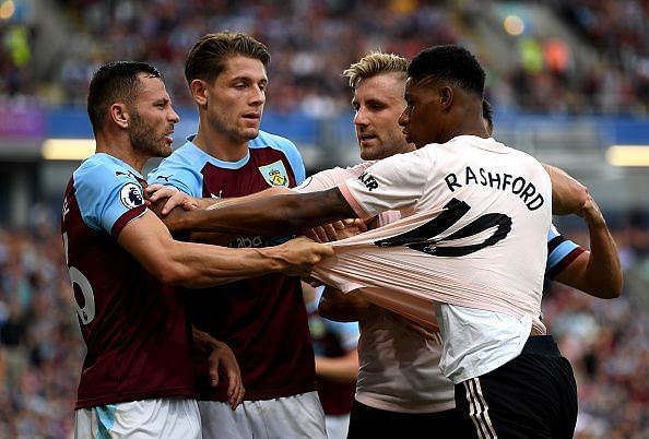 Rashford in a tussle with Burnley&#039;s Phil Bardsley - which led to a sending off