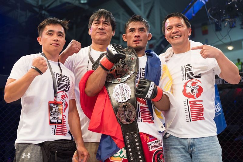 Stephen Loman poses with Team Lakay after the historic win at Brave 18