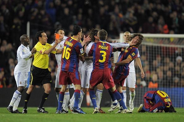 Real Madrid&#039;s Sergio Ramos pushes Carles Puyol and is sent-off eventually.