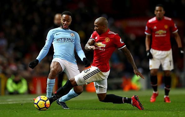 Sterling and Young battling it out last season at Old Trafford