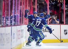 Pouliot caps Pettersson's big night, Canucks beat Avs in OT