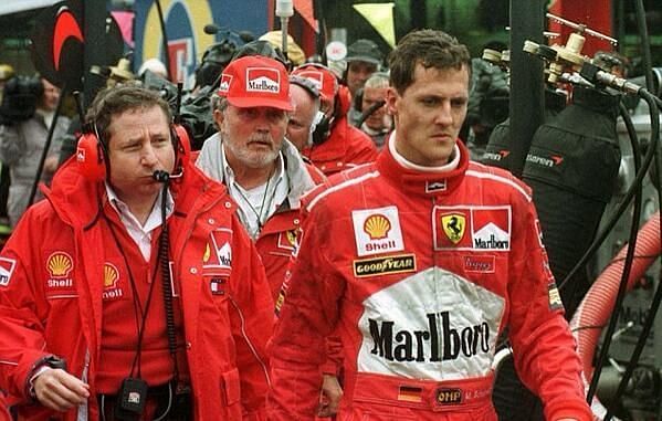 Michael Schumacher took on David Coulthard in the pit garage