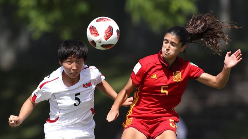 Ri Kum-Hyang from North Korea and Spain&#039;s Jana Fern&Atilde;&iexcl;ndez on the right in action (Image Courtesy: FIFA)